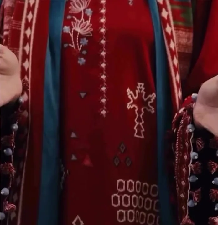 Nishat Linen winter fabric in deep red with white embroidery